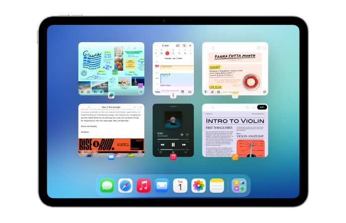 iPad, orientace na šířku, na obrazovce je několik aplikací jako Kalendář a Hudba v souměrném uspořádání šesti oken ve dvou řadách