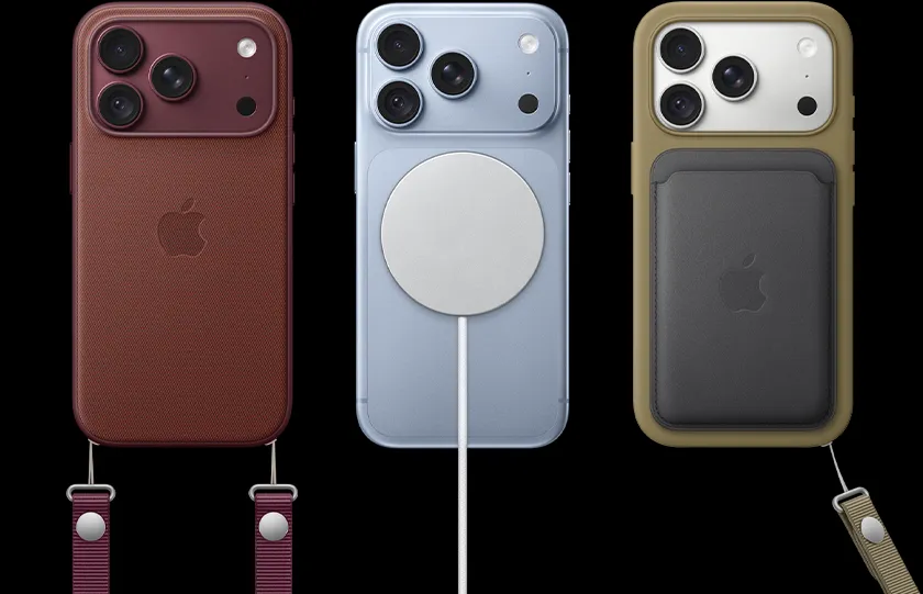 From left to right, iPhone 18 Pro in Burgundy leather case with Burgundy Crossbody strap, middle iPhone 18 Pro in Glacier with White MagSafe charger attached, right iPhone 18 Pro in Silver in green phone case, black leather wallet case with wrist strap.