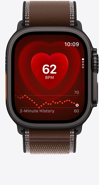 Apple Watch Ultra 4, screen shows Heart Rate app, current beats per minute, titanium case, black color, connected to Trail Loop band, dark umber color (brown)