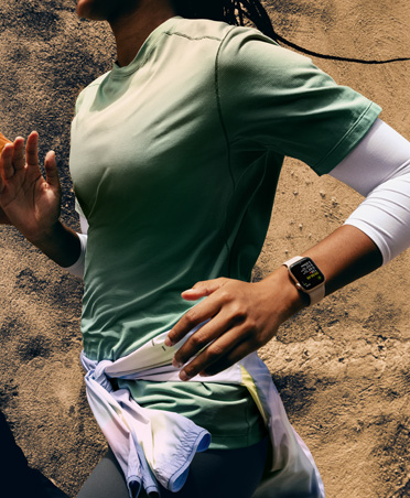 A person running wears Apple Watch on their left wrist 
