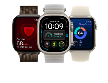 Three Apple Watch devices: Apple Watch Series 11, rose gold color, aluminum case, Apple Music, playlist controls, right side exterior, Digital Crown, light blush color Sport Band, silver pin-and-tuck closure, Apple Watch Ultra 3, natural color, titanium case, edge-to-edge display, photo overlaid on time, right side exterior, Digital Crown, anchor blue color Ocean Band, tubular fluoroelastomer rubber, Apple Watch SE 3, aluminum case, midnight color, right side exterior, Digital Crown, advanced Outdoor Run workout metrics