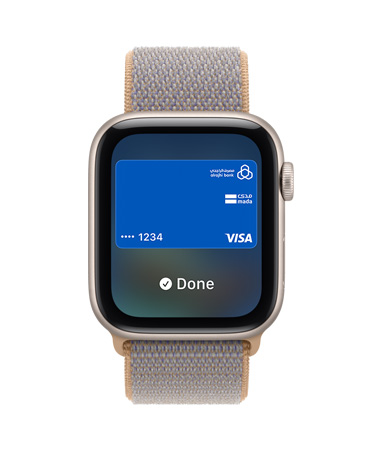 Apple Watch SE 3, aluminum case, starlight color, screen shows Wallet, payment card graphic, right side exterior, Digital Crown dial, Sport Loop band, chambray blue color (light blue-gray)