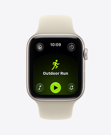 Apple Watch SE 3, aluminium case, starlight colour, screen shows Workout app (outdoor run), right side exterior, Digital Crown dial, Sport Band, sand colour (pale tan)