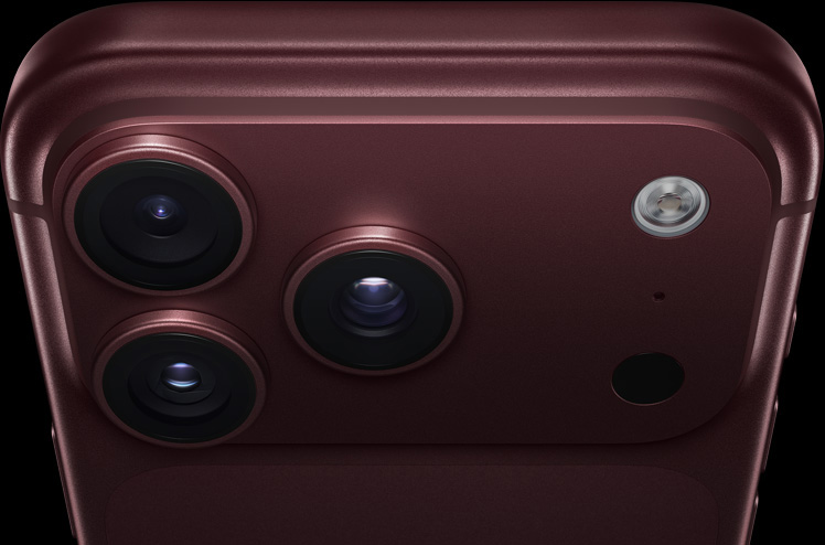 iPhone 18 Pro, burgundy finish, partial back exterior angled to show pro camera system in top left corner, 3 lenses, microphone, flash