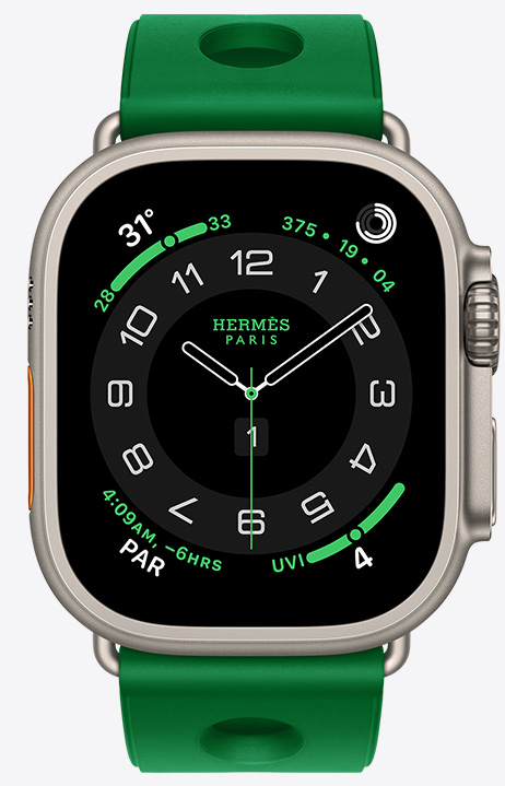 Apple Watch Hermès Ultra 4, Circulaire analogue watch face, (hour, minute and second hands, complications: Weather, Activity rings, Paris time and UV index), titanium case, natural colour, right side exterior, Digital Crown, raised side button, paired with Scub’H Diving strap, Vert Vertigo colour (bright green), moulded rubber material, circular cutouts centred