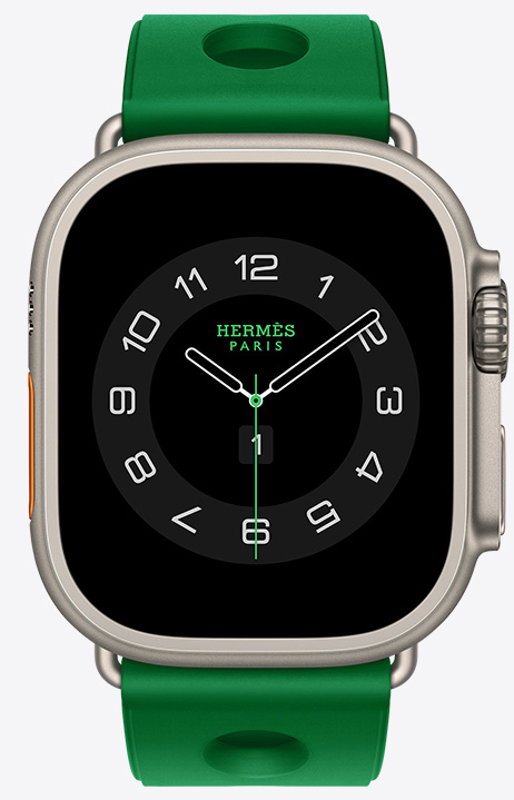 原色鈦金屬錶殼 Apple Watch Hermès Ultra 4，採用 Circulaire 指針錶面 (小時、分鐘與秒針，以及多項複雜功能，包括天氣、活動記錄圓圈、巴黎時間與紫外線指數)，右側外觀上有數位錶冠、凸起的側邊按鈕，搭配 Vert Vertigo 炫綠色 (亮綠色系) Scub'H Diving 錶帶，錶帶由橡膠材質模塑成型，中央有圓孔鏤空設計