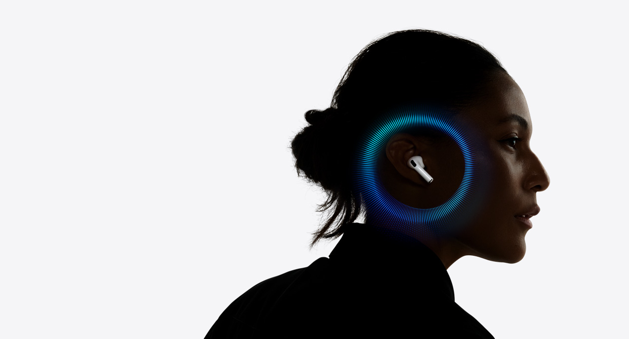 Eine Person, die AirPods Pro 3 trägt, mit pulsierenden Wellen um ihr Ohr