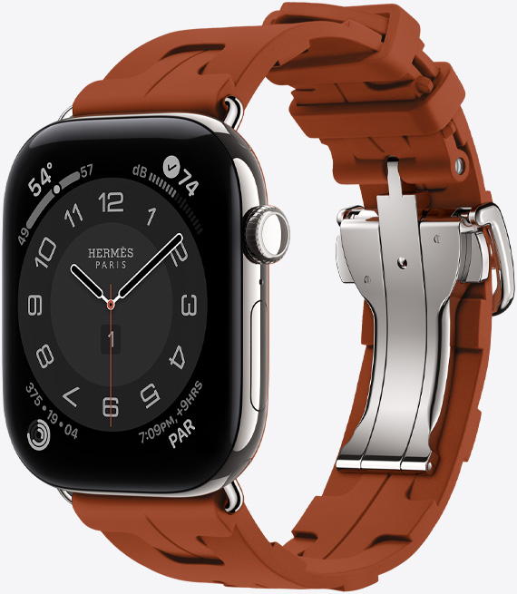 Apple Watch Hermès Series 12, analoges Circulaire Zifferblatt, (Stunden-, Minuten- und Sekundenzeiger, Komplikationen: Wetter, Geräusche, Aktivitätsringe und Paris Zeit), Titangehäuse, Farbe Silber, rechte Seitenansicht, Digital Crown, Seitentaste, kombiniert mit Kilim Single Tour Armband, Farbe Cuivre (Braun), geformtes Gummimaterial, geometrisches, ineinandergreifendes Design, silberfarbene Metallschliesse