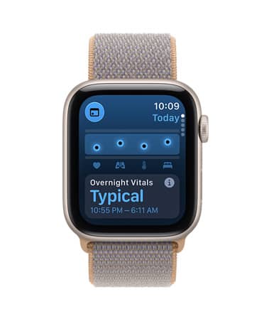 Apple Watch SE 3, screen shows overnight vitals, aluminum case, starlight color, right side exterior, Digital Crown dial, connected to Sport Loop band, chambray blue color (light blue-gray)