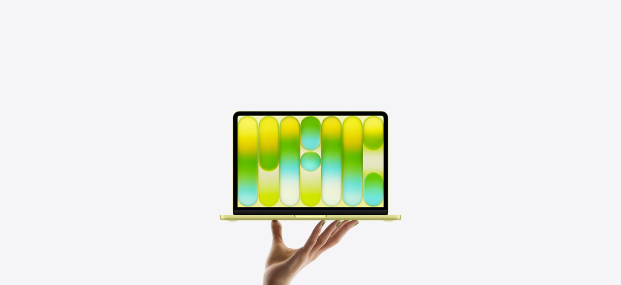 MacBook Neo en un brillante color amarillo cítrico, sostenido en equilibrio en la punta de los dedos de una mano abierta, la pantalla muestra un patrón abstracto y colorido