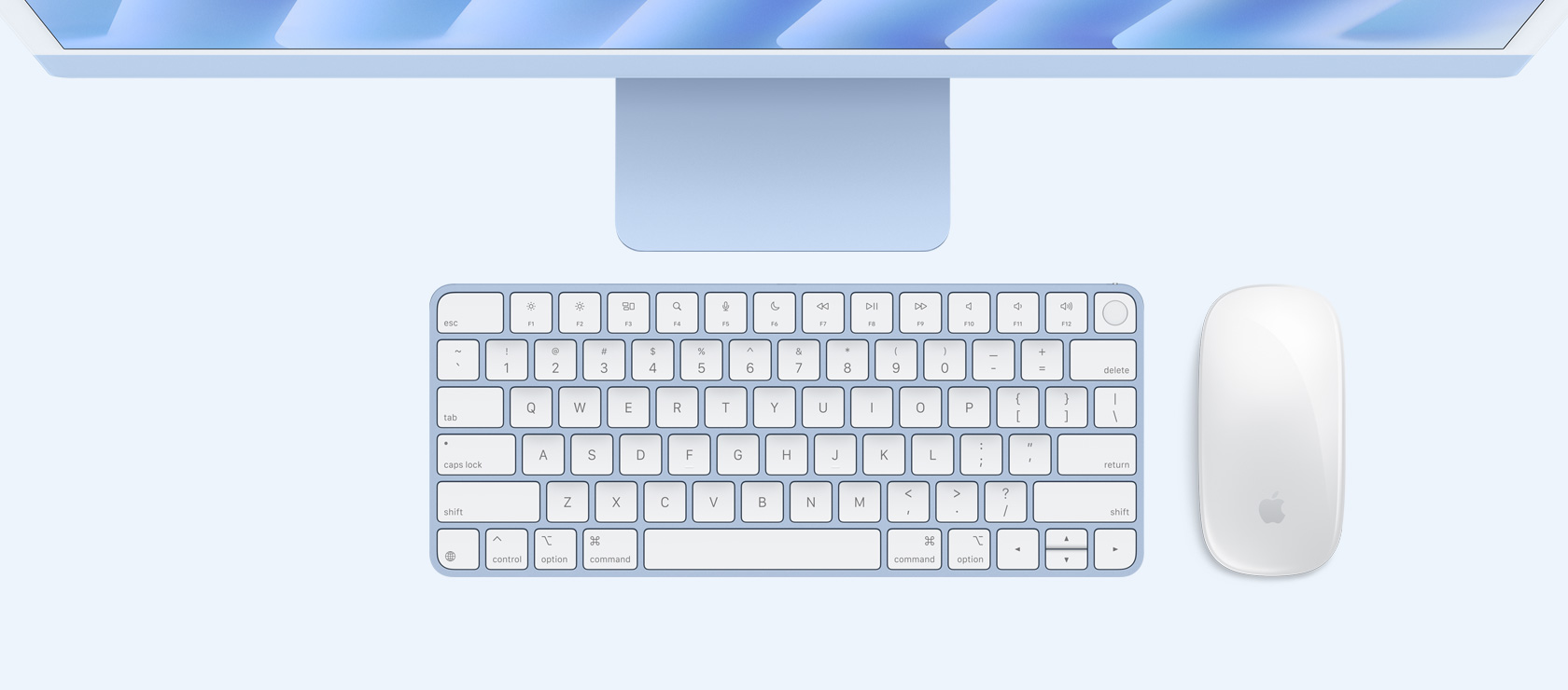 Imagem aérea de um iMac azul com mouse e keyboard na mesma cor