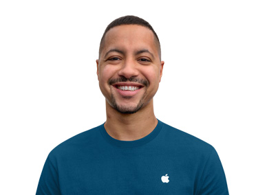 Apple Specialist smiling with an approachable demeanor